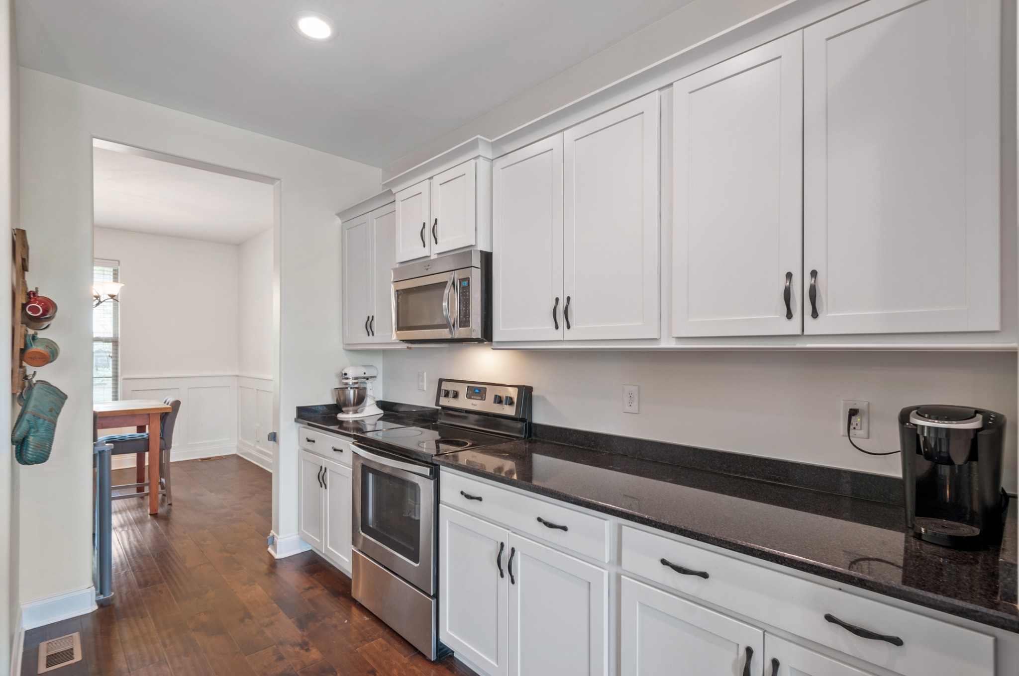 3056 Everleigh Place Spring Hill, TN 37174 - Photo 12 of 43 a kitchen with white cabinets and appliances
