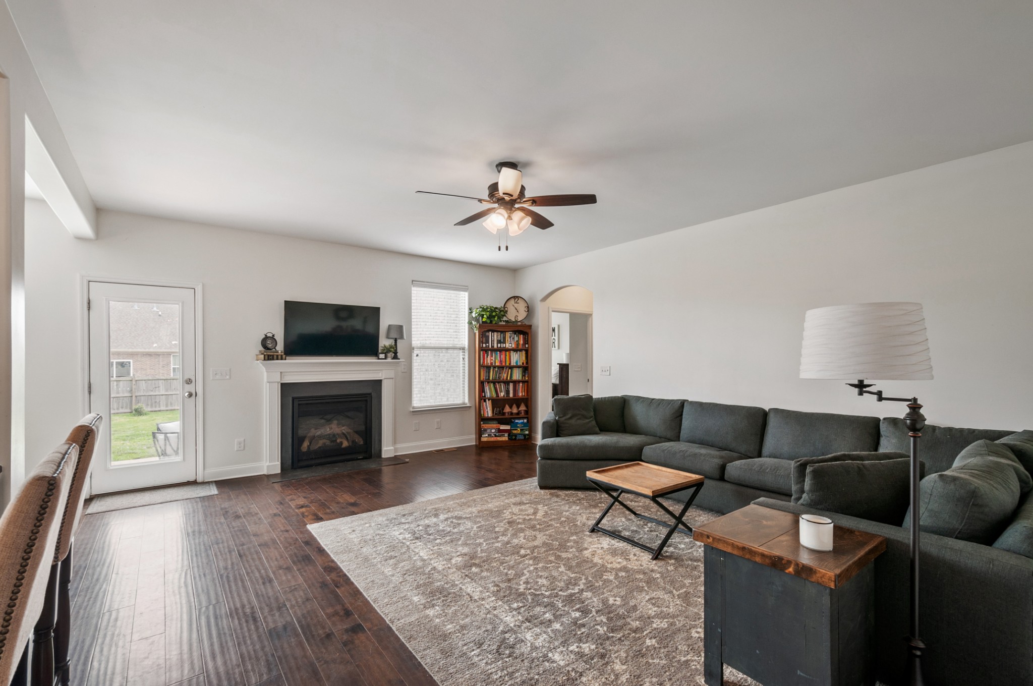 3056 Everleigh Place Spring Hill, TN 37174 - Photo 18 of 43 a living room with furniture and a fireplace