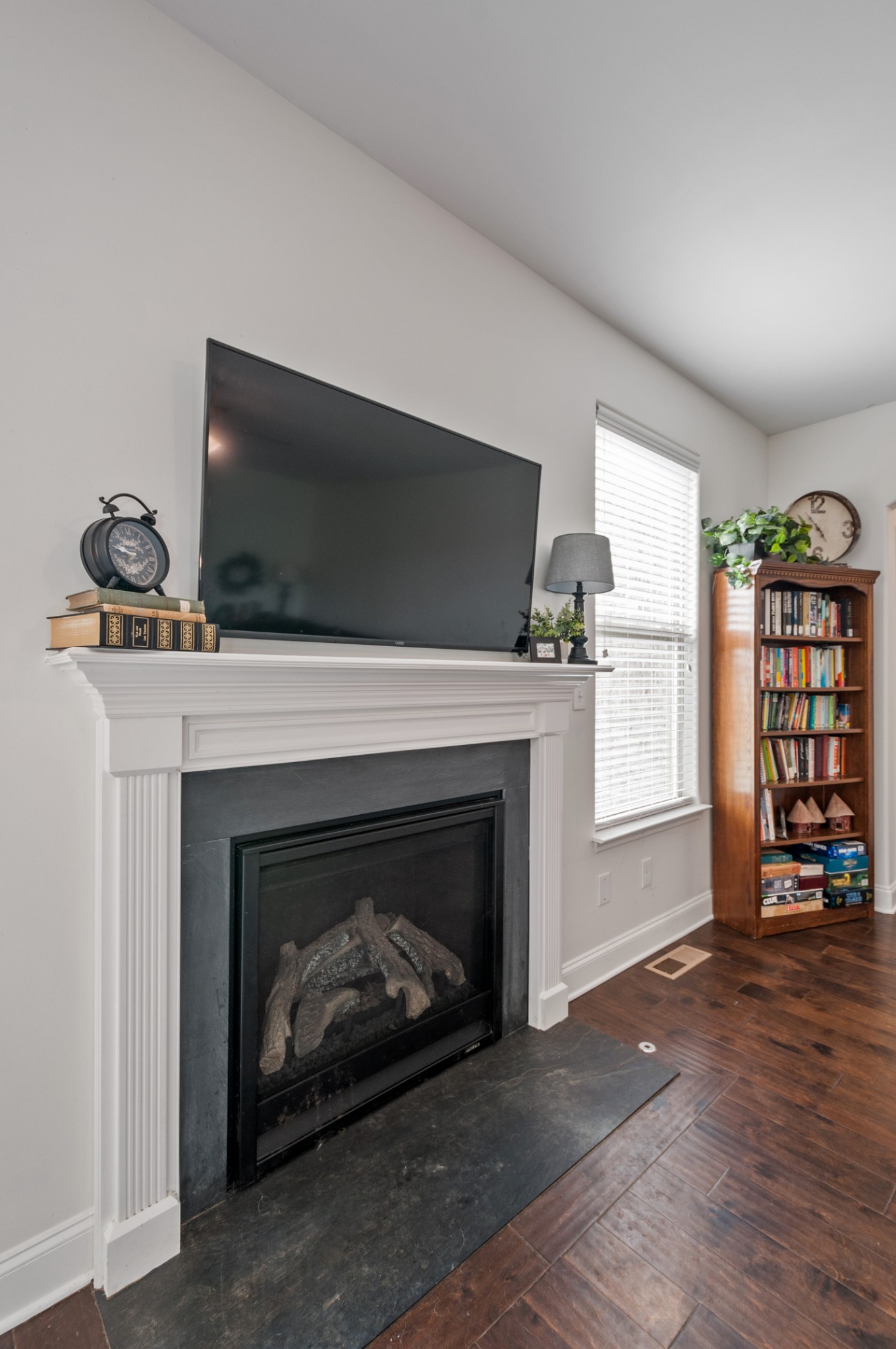 3056 Everleigh Place Spring Hill, TN 37174 - Photo 20 of 43 a living room with furniture a fireplace and a flat screen tv