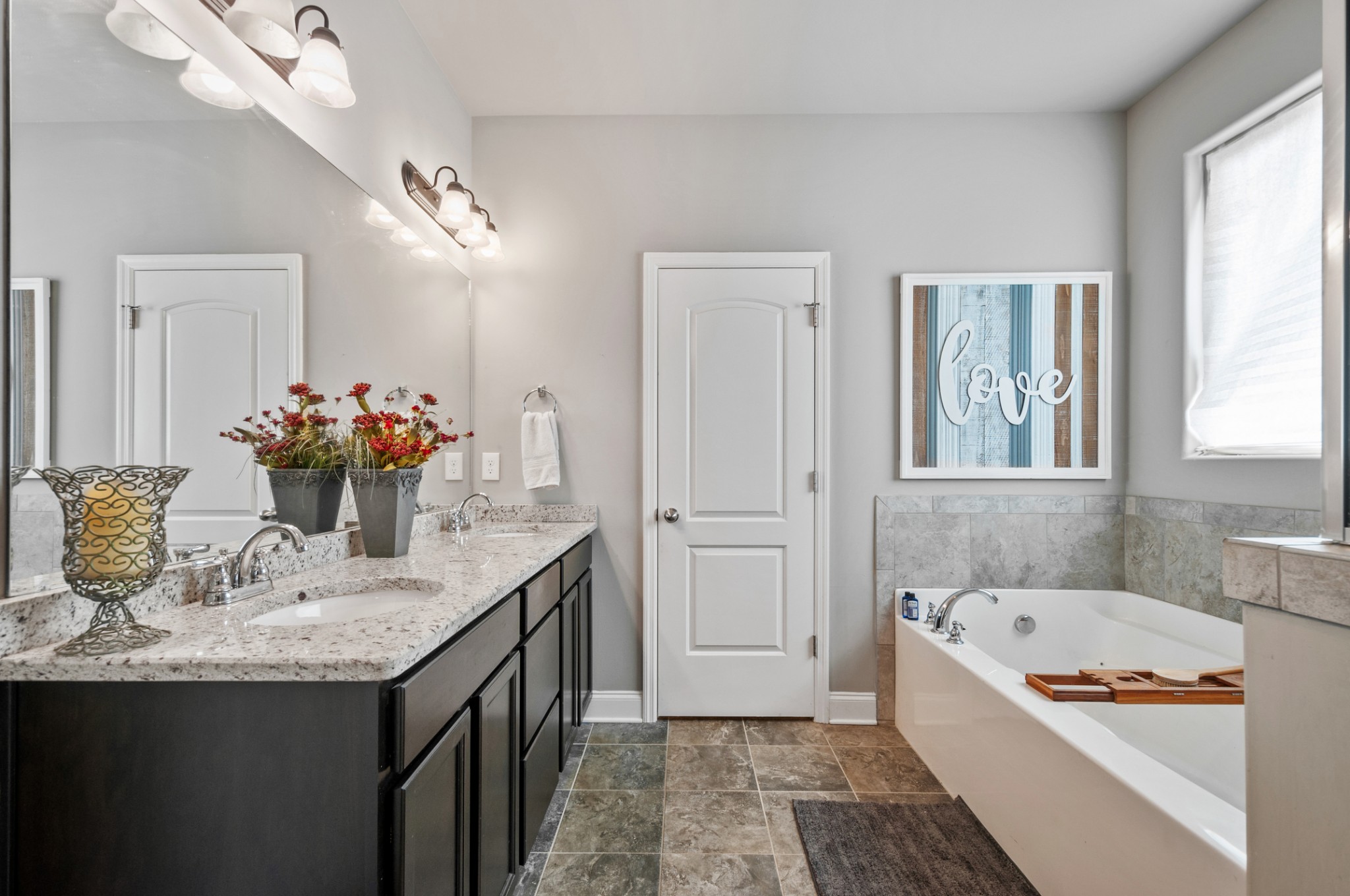 3056 Everleigh Place Spring Hill, TN 37174 - Photo 24 of 43 a bathroom with a granite countertop sink and a mirror