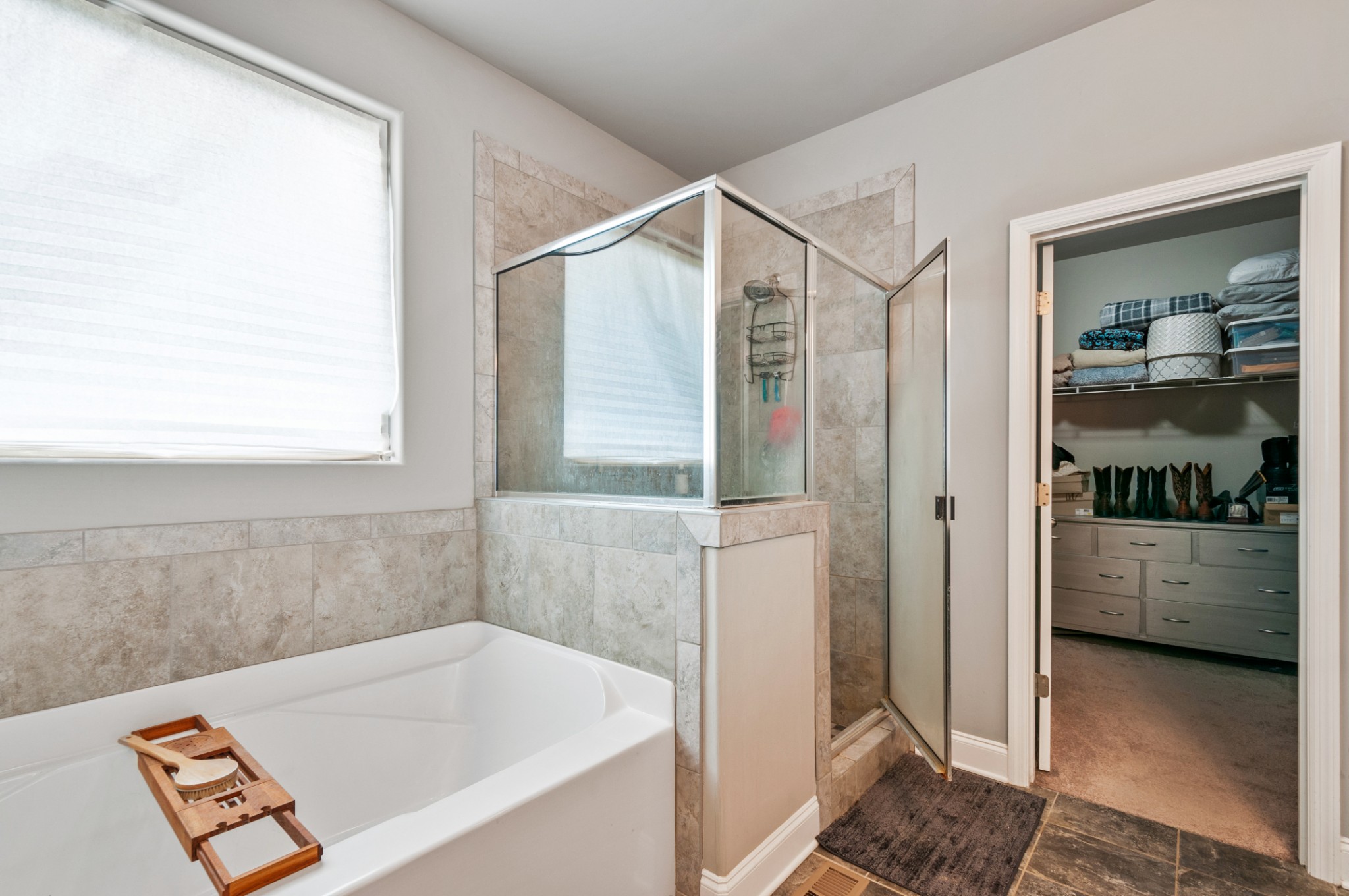 3056 Everleigh Place Spring Hill, TN 37174 - Photo 25 of 43 a bathroom with a tub and a shower
