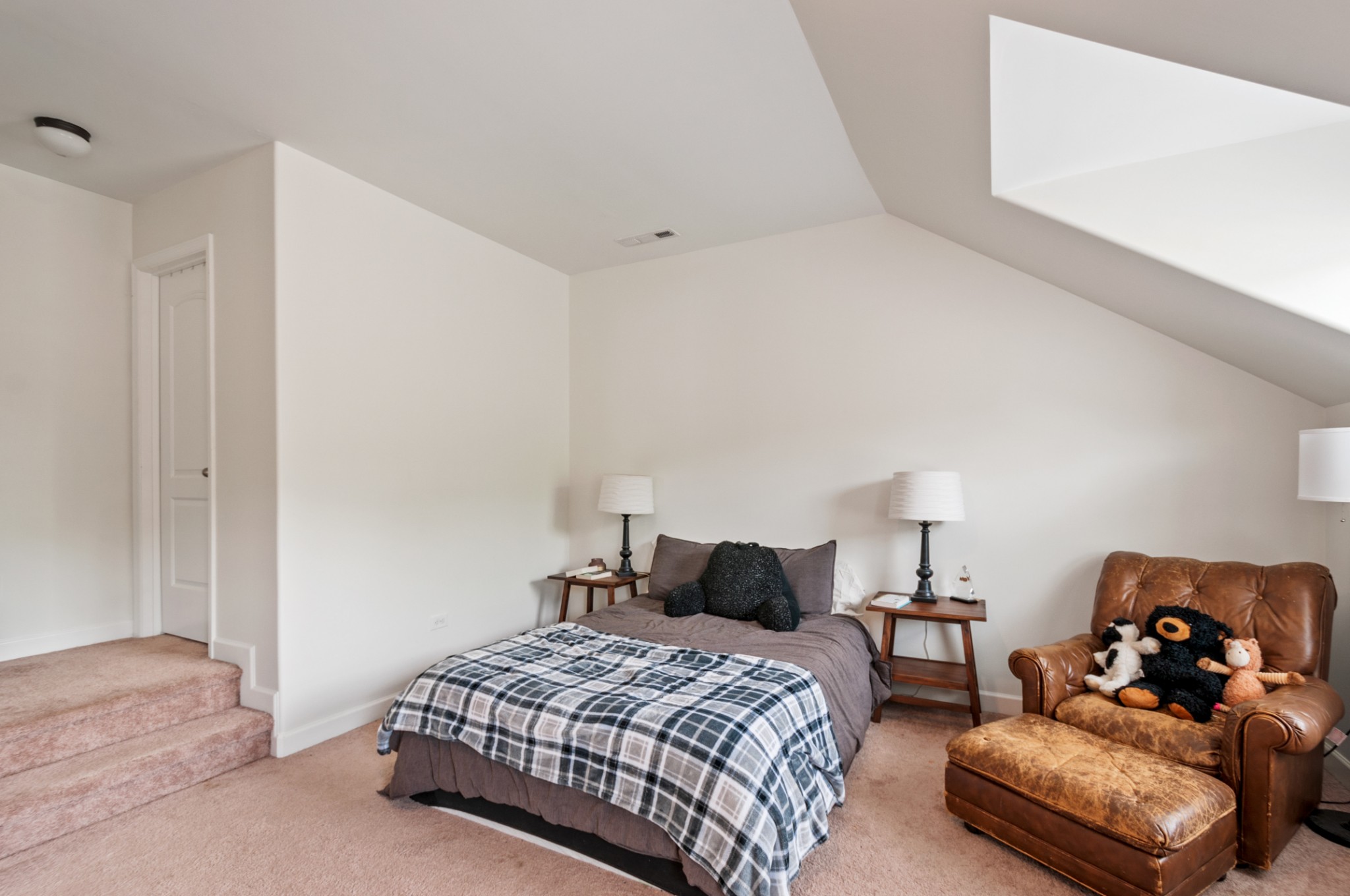 3056 Everleigh Place Spring Hill, TN 37174 - Photo 28 of 43 a bedroom with a bed and lamp