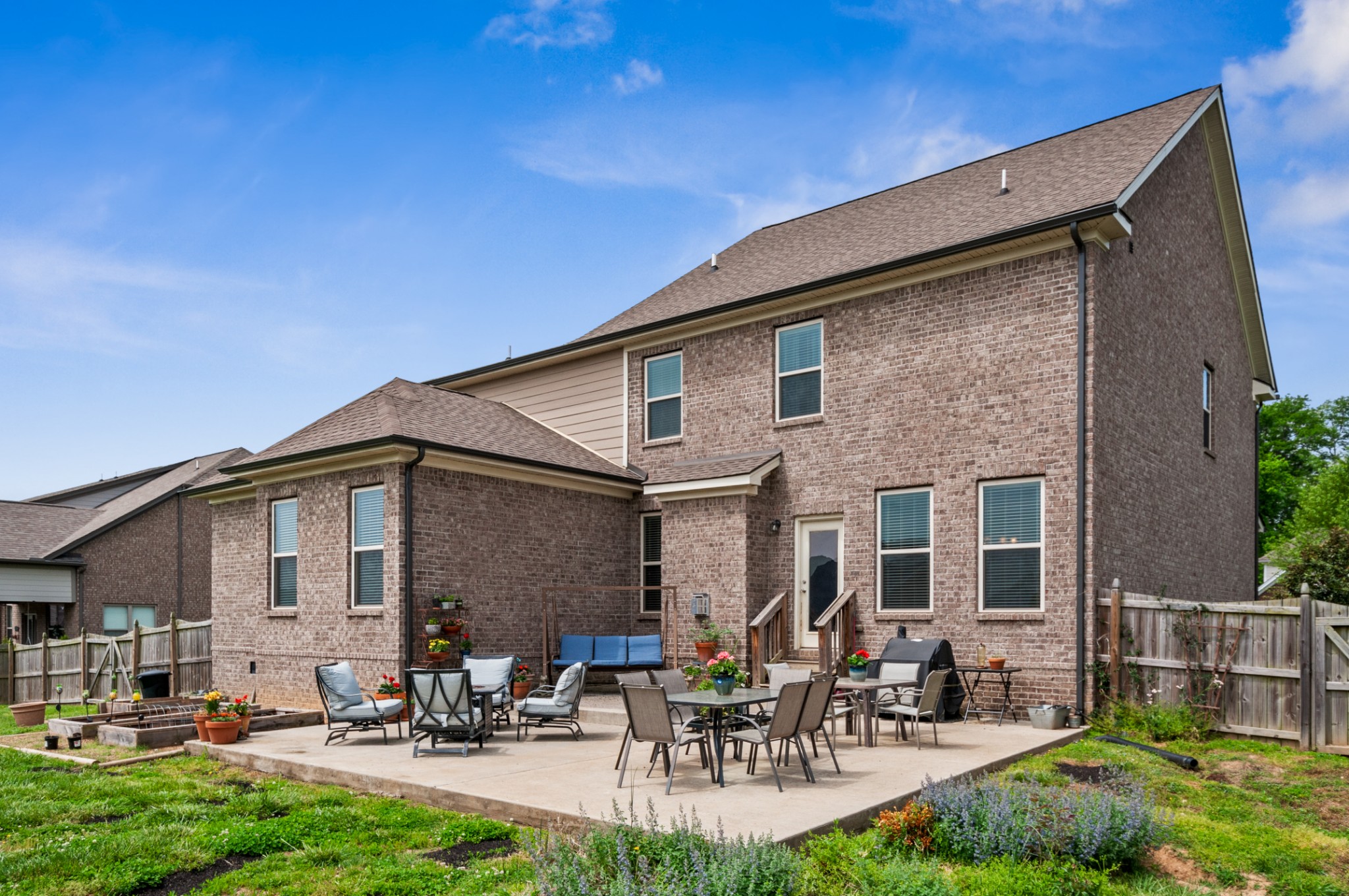 3056 Everleigh Place Spring Hill, TN 37174 - Photo 39 of 43 a backyard of a house with outdoor seating