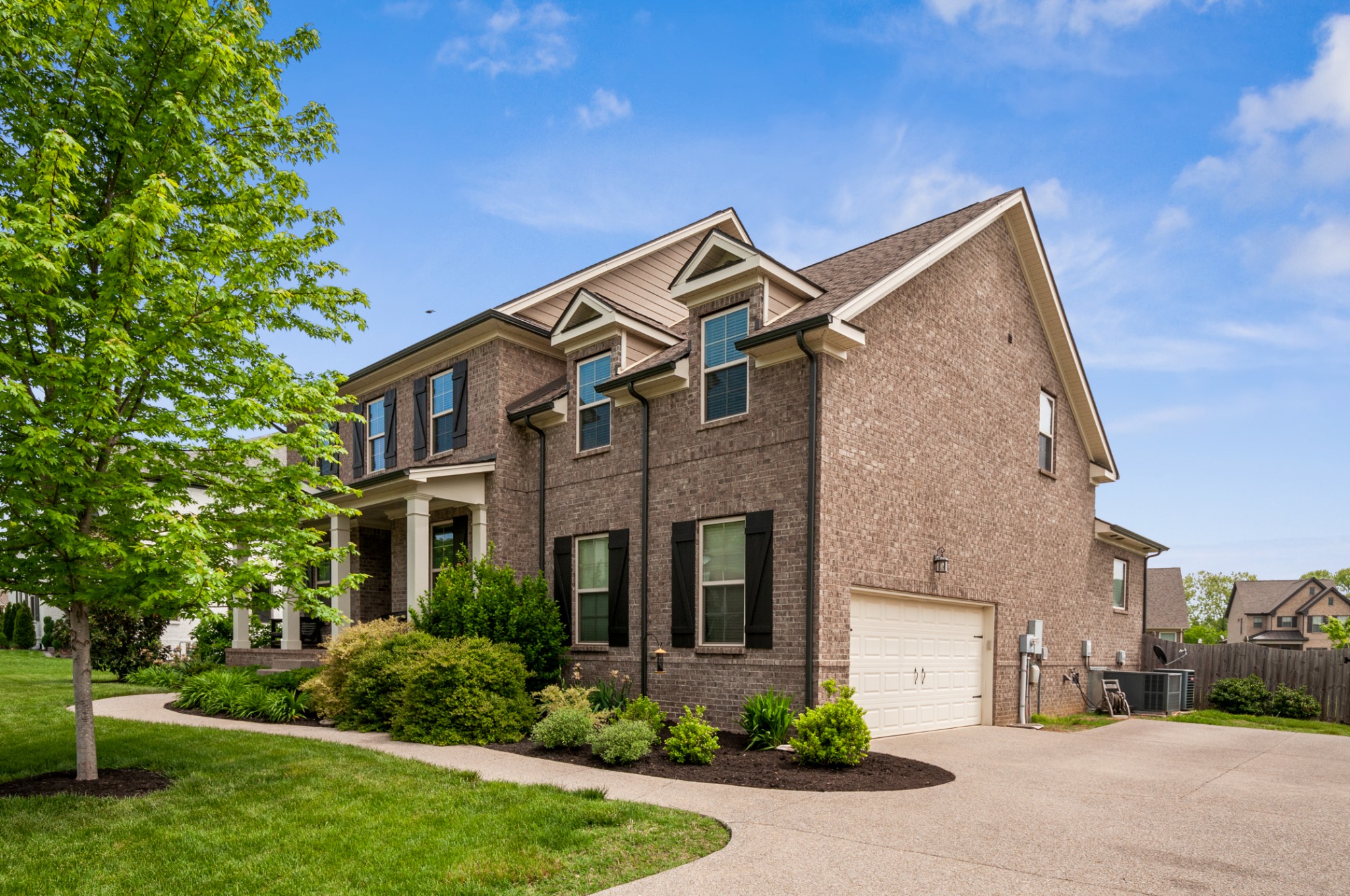 3056 Everleigh Place Spring Hill, TN 37174 - Photo 43 of 43 a front view of a house with garden