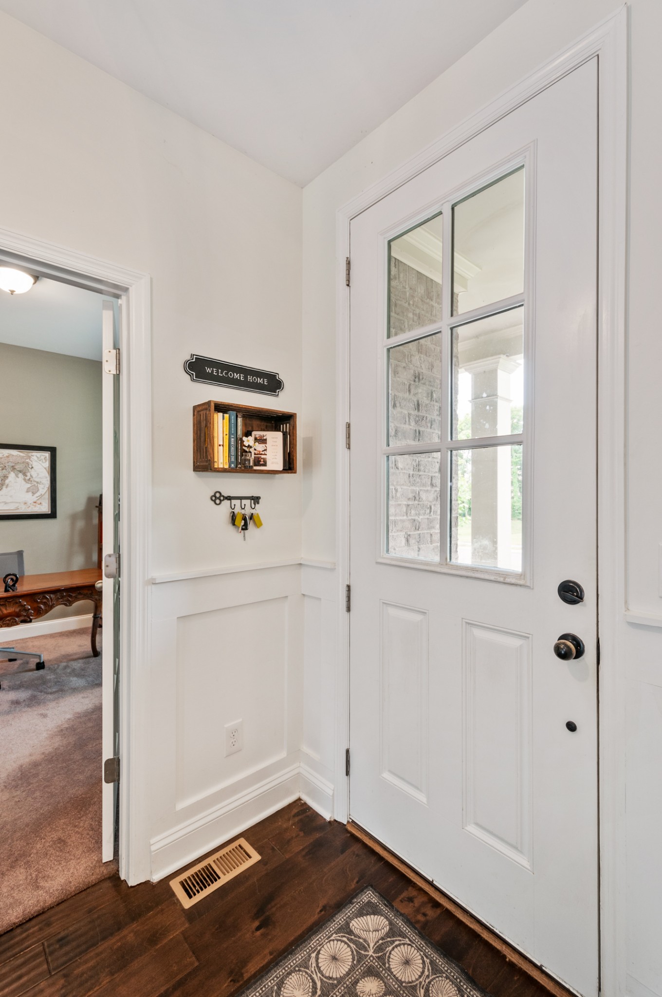 3056 Everleigh Place Spring Hill, TN 37174 - Photo 7 of 43 a view of a hallway with wooden floor and closet