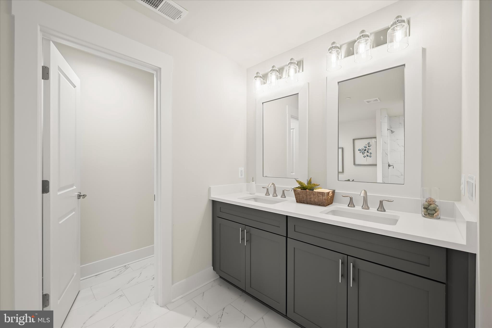 618 Deer Park Road Westminster, MD 21157 - Photo 36 of 57 a bathroom with a double vanity sink and mirror