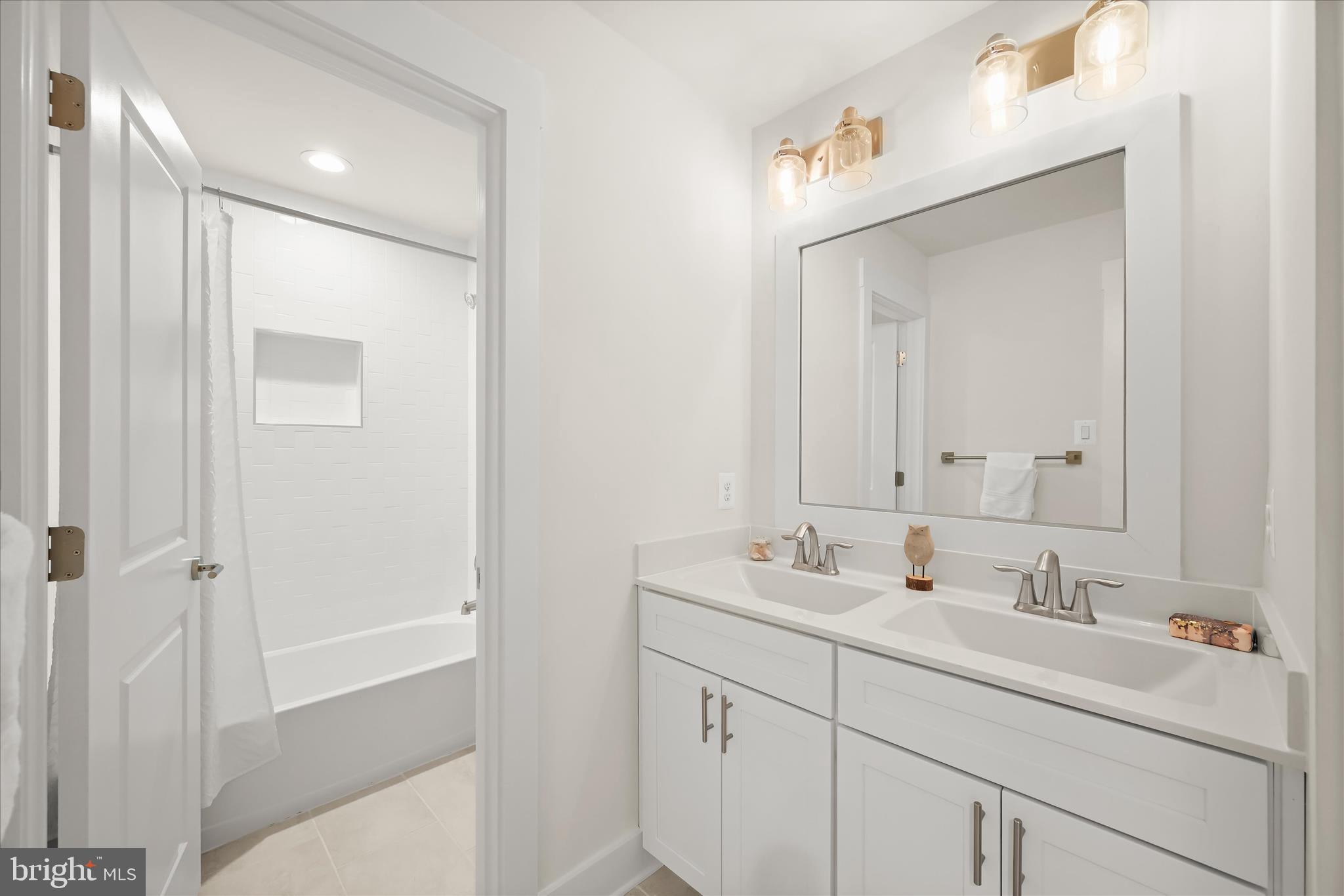 618 Deer Park Road Westminster, MD 21157 - Photo 41 of 57 a bathroom with a sink double vanity and a mirror