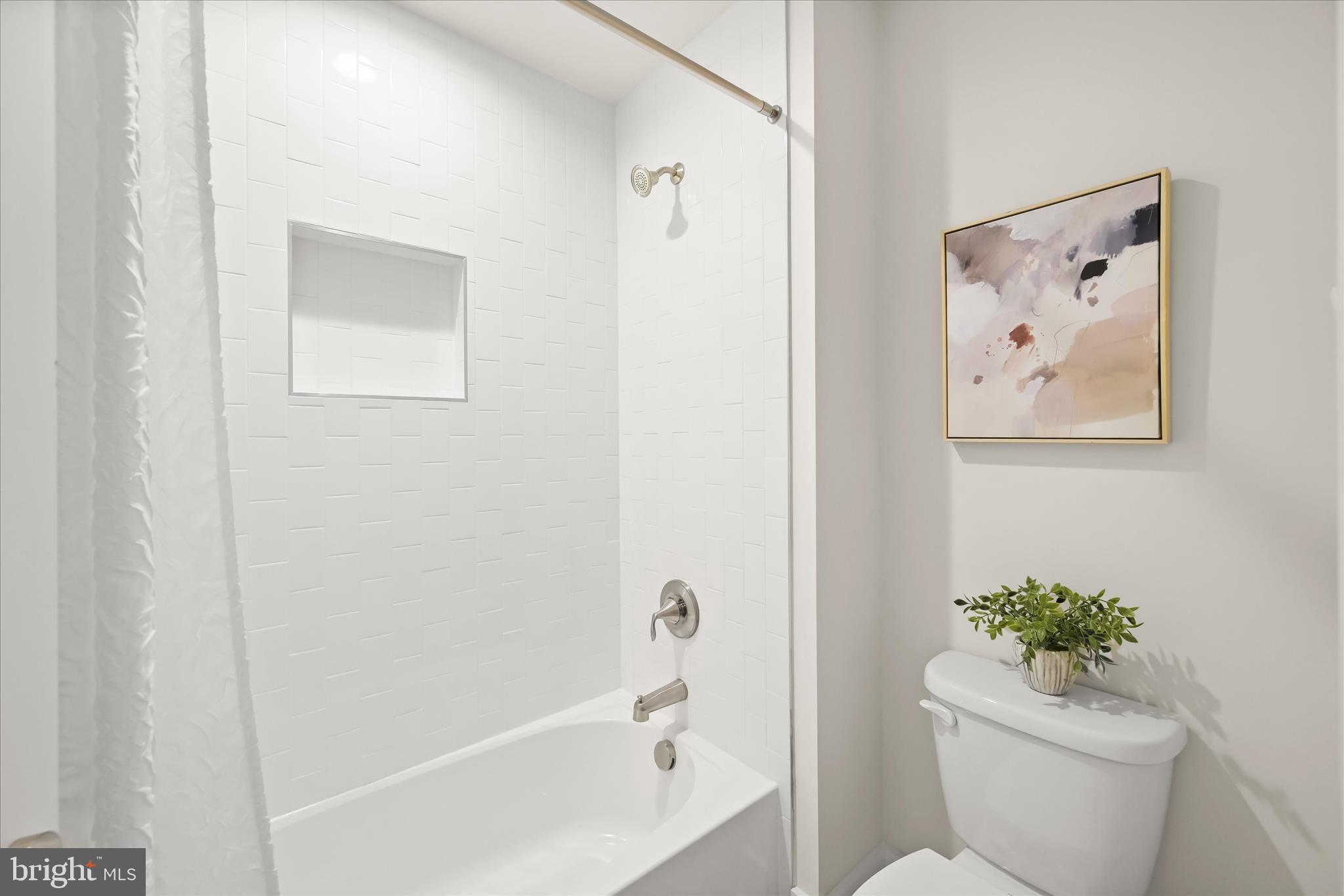 618 Deer Park Road Westminster, MD 21157 - Photo 42 of 57 a bath room with a toilet and a bath tub