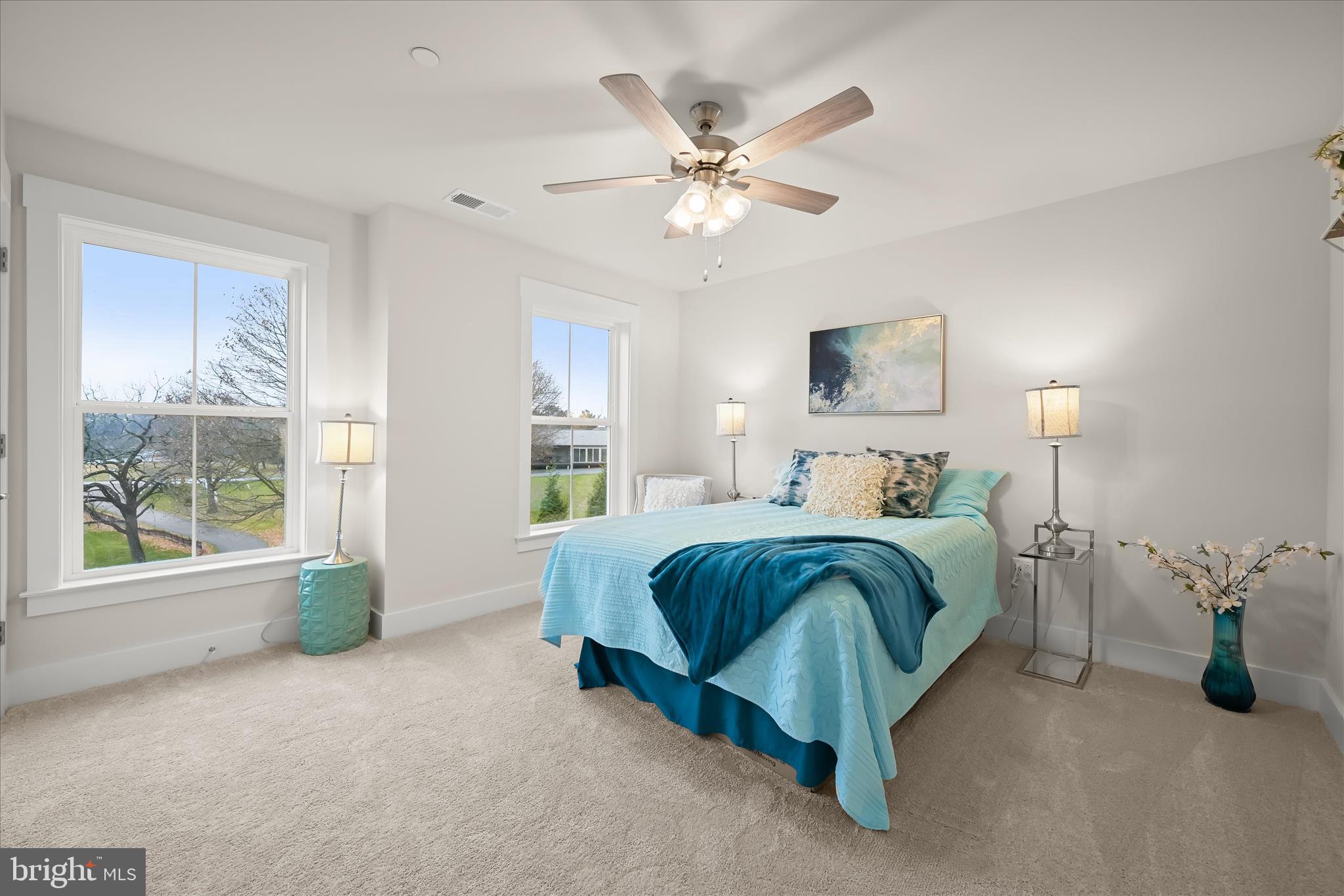 618 Deer Park Road Westminster, MD 21157 - Photo 46 of 57 a spacious bedroom with a bed and a chandelier