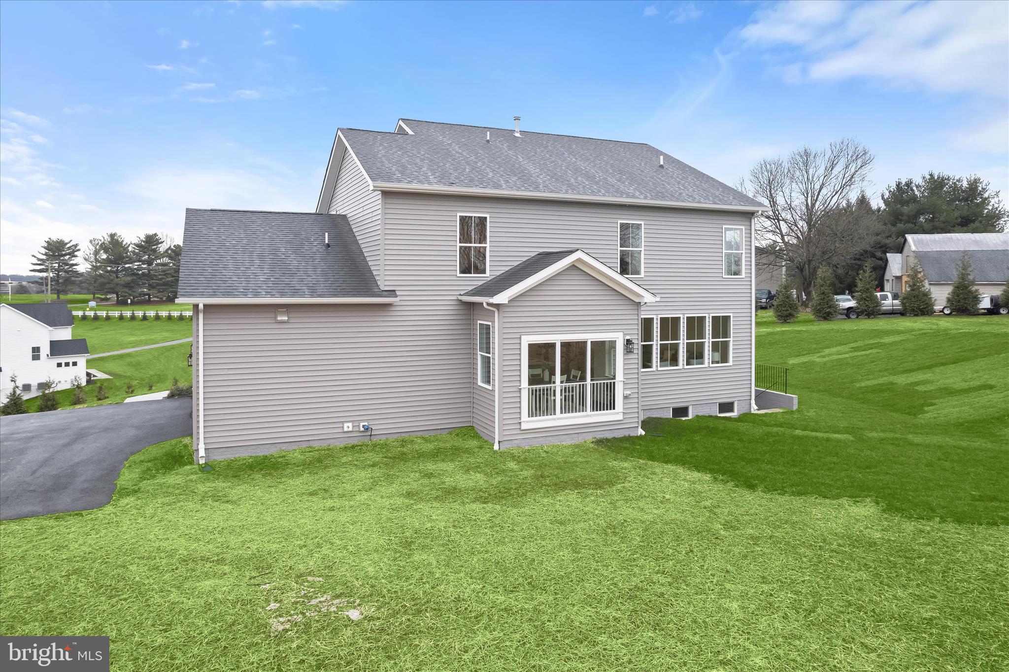 618 Deer Park Road Westminster, MD 21157 - Photo 52 of 57 a front view of a house with a yard and garage