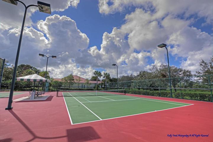 8984 Southeast Hawks Nest Court Hobe Sound, FL 33455 - Photo 12 of 21 a view of a tennis court