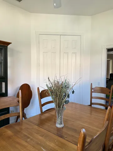 a view of a dining room with furniture window and outside view