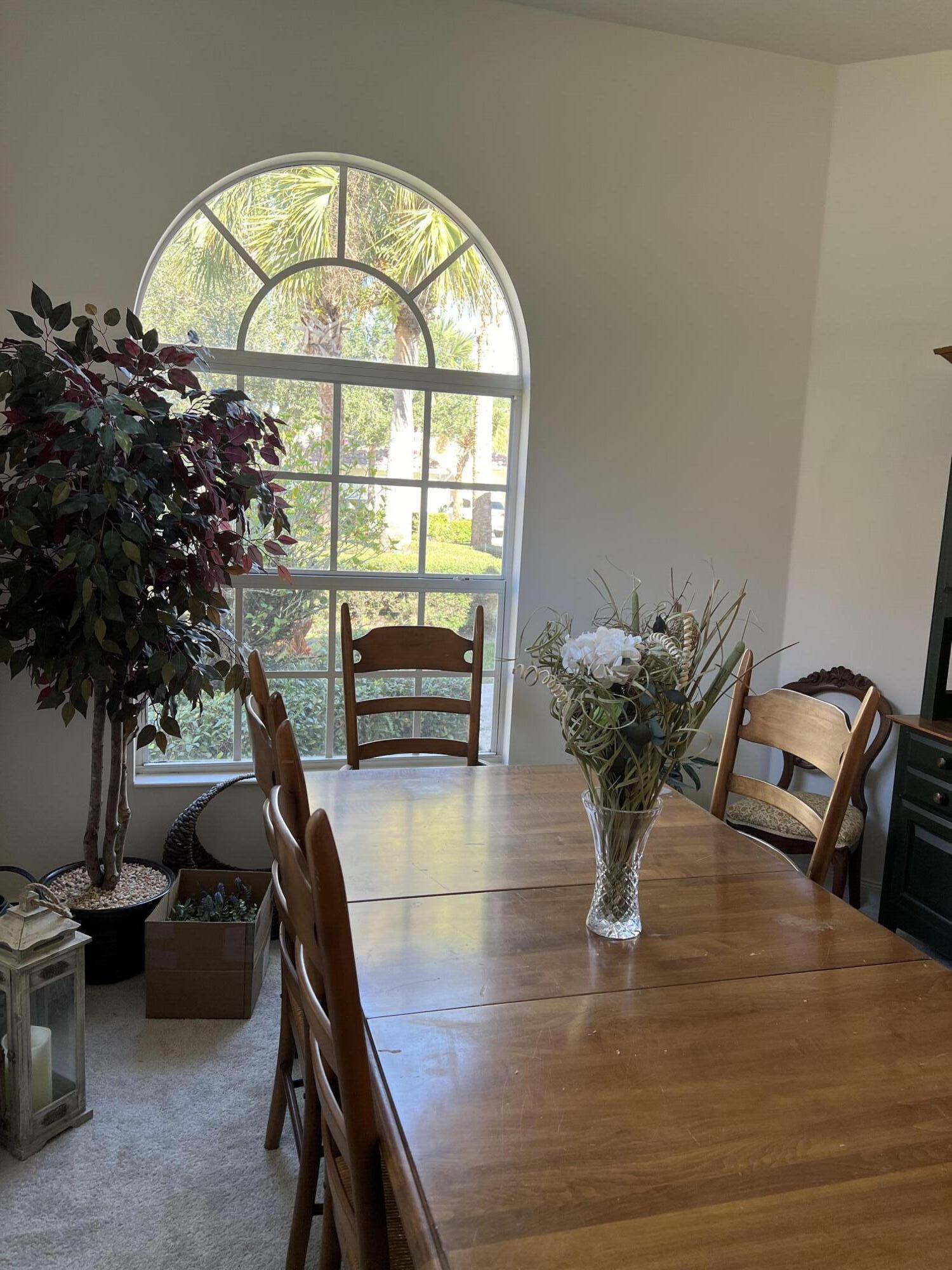 8984 Southeast Hawks Nest Court Hobe Sound, FL 33455 - Photo 20 of 21 a view of a livingroom with furniture and a potted plant
