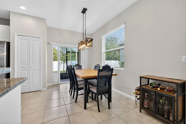 a view of a dining room with furniture and window