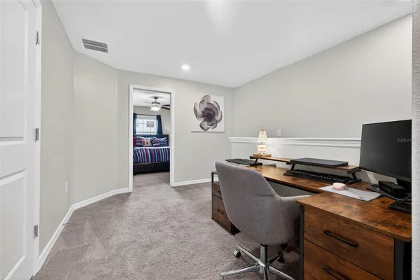a workspace with furniture and wooden floor
