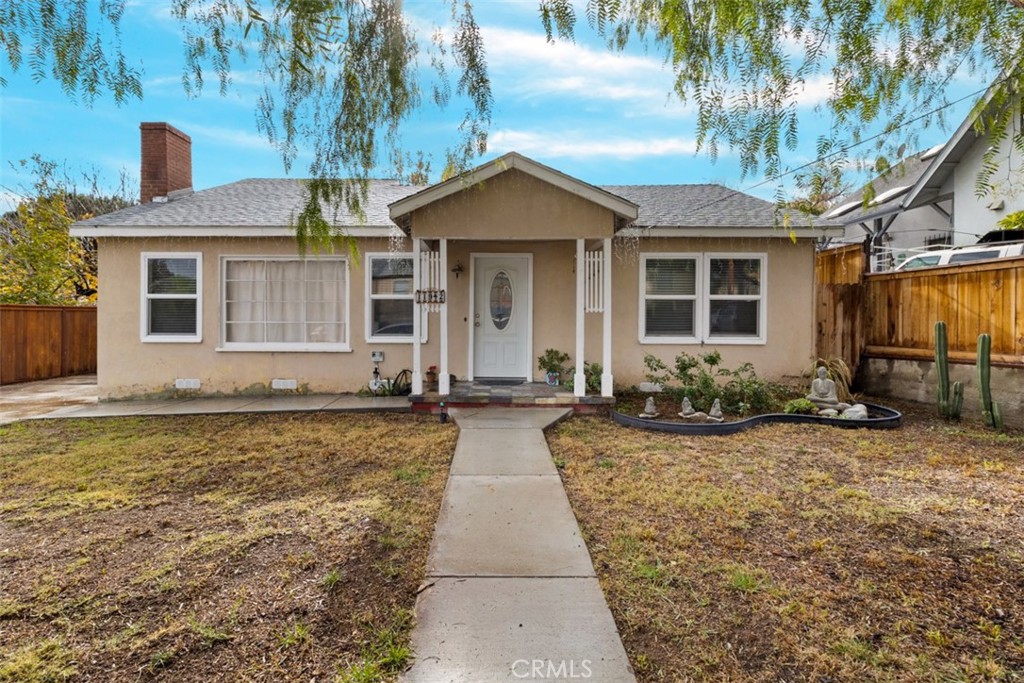 11942 Raley Drive Riverside, CA 92505 - Photo 1 of 1 a view of a house with backyard and tree
