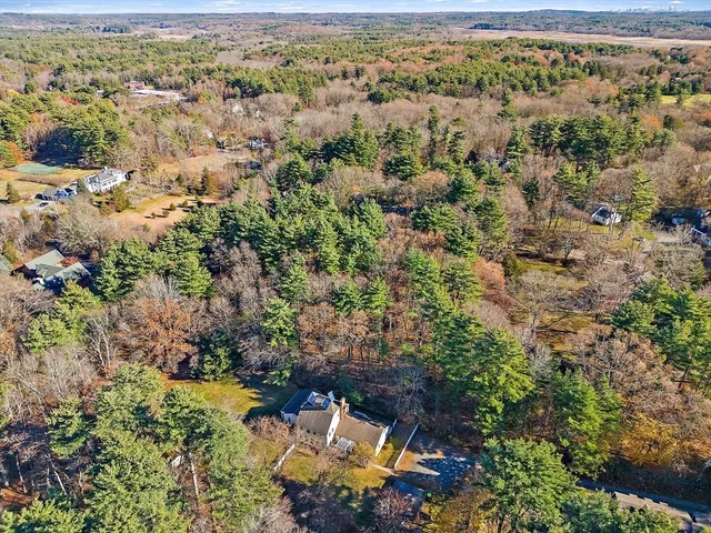 an aerial view of residential house with outdoor space