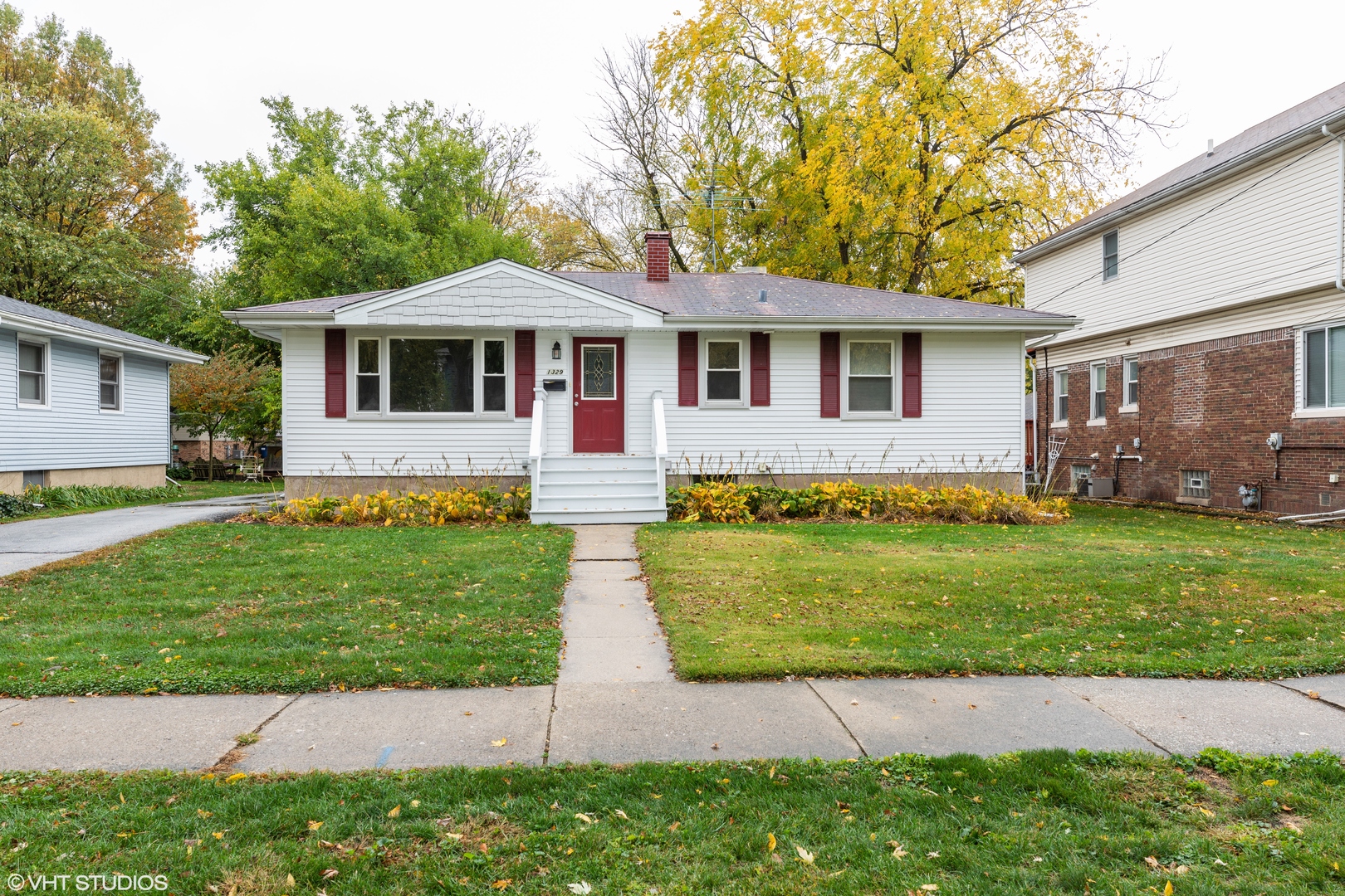 a front view of a house with a garden