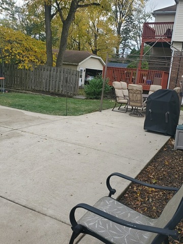 1329 Olive Road Homewood, IL 60430 - Photo 17 of 17 a wooden bench sitting in front of a house
