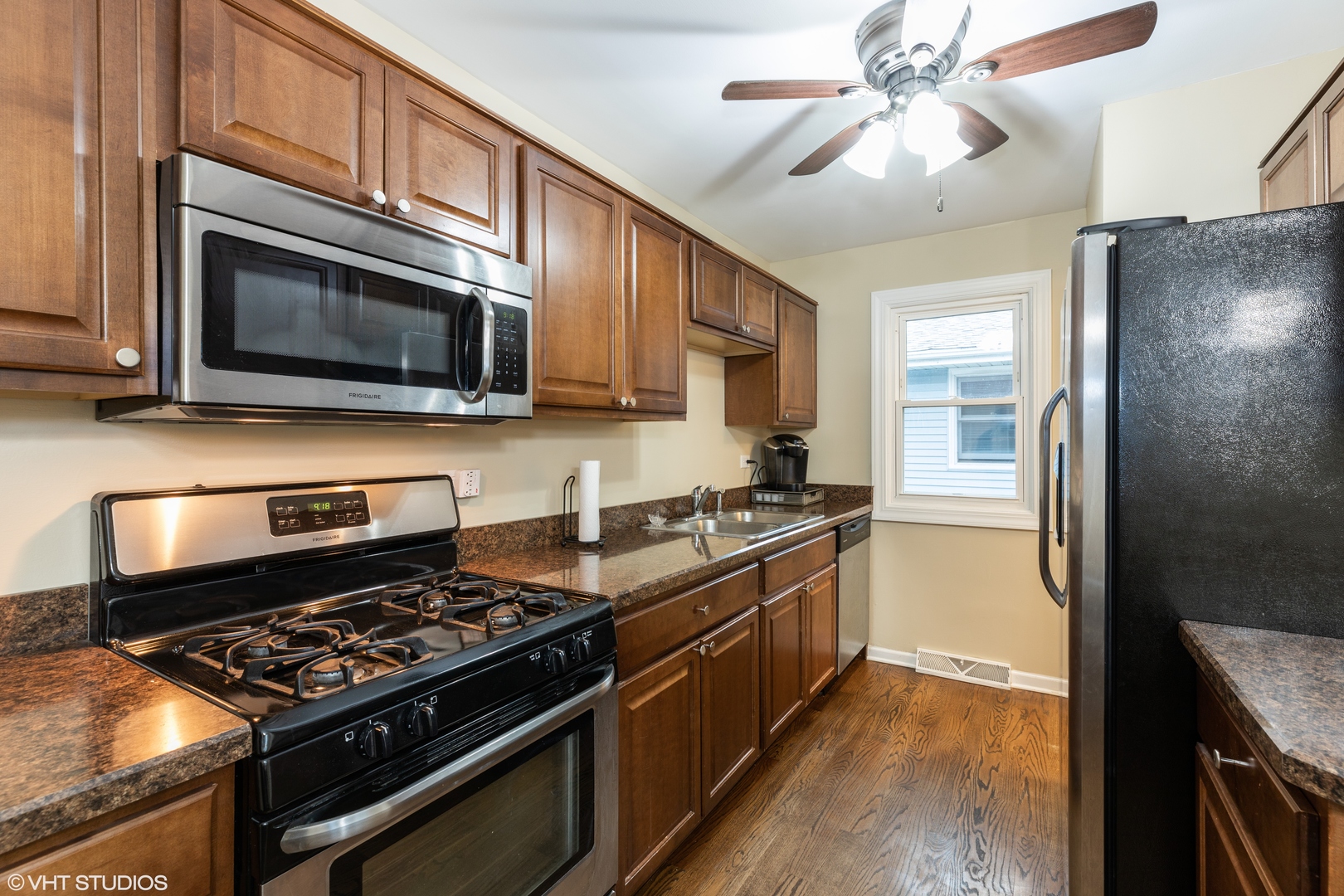 1329 Olive Road Homewood, IL 60430 - Photo 3 of 17 a kitchen with stainless steel appliances granite countertop a stove a refrigerator and a microwave