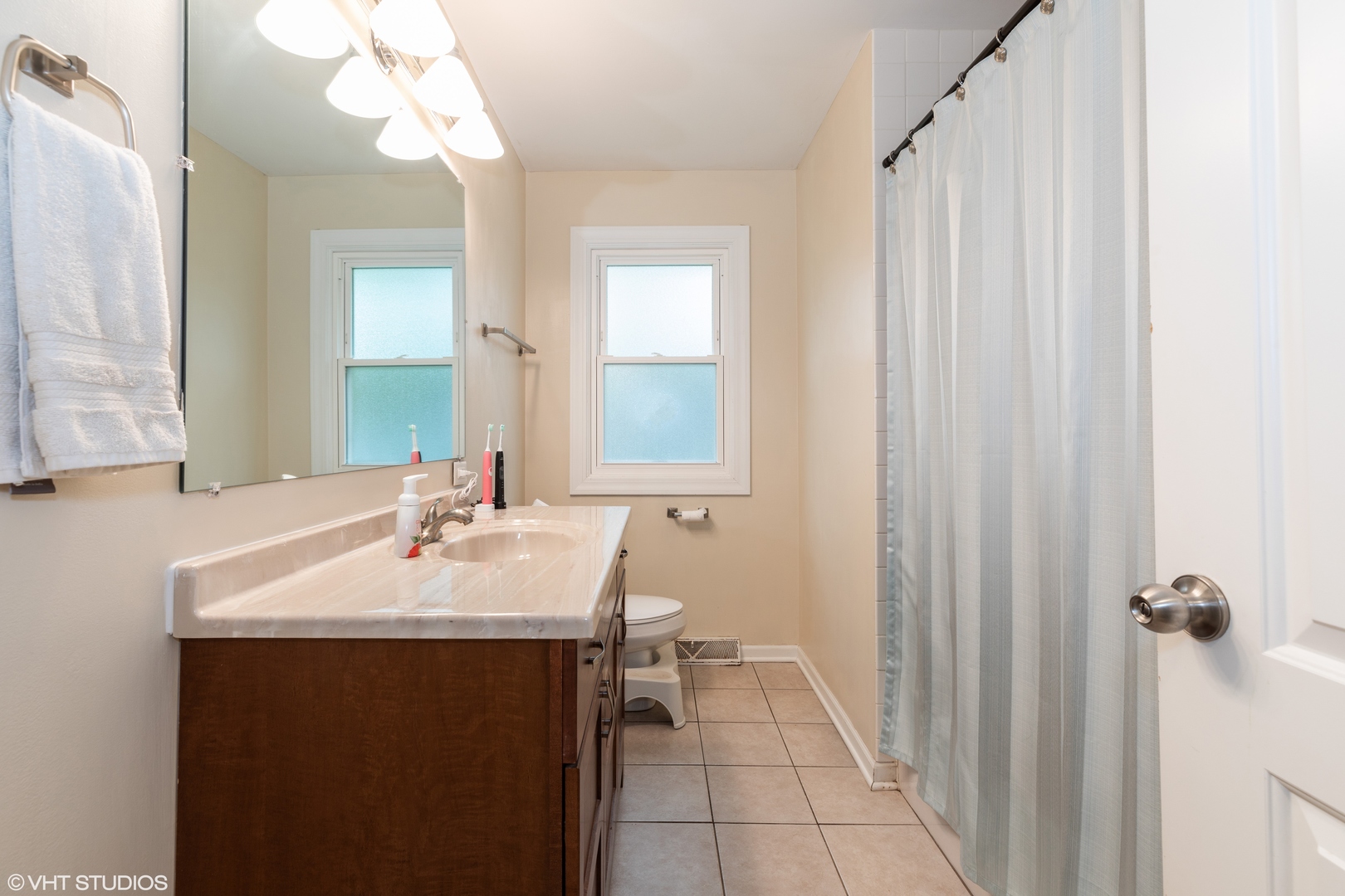 1329 Olive Road Homewood, IL 60430 - Photo 10 of 17 a bathroom with a sink vanity granite and a mirror