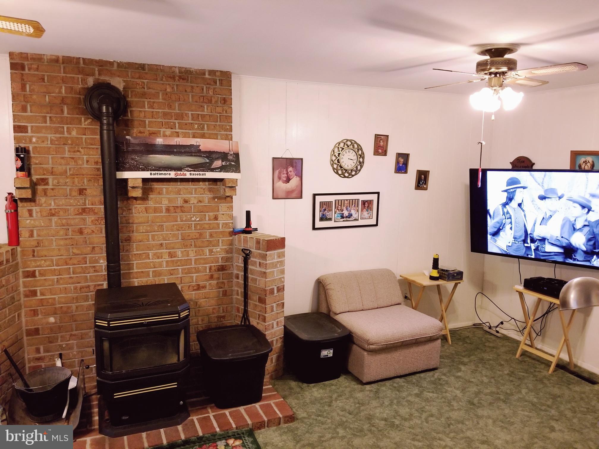 9017 Tammy Road Baltimore, MD 21236 - Photo 13 of 23 a living room with furniture and a fireplace