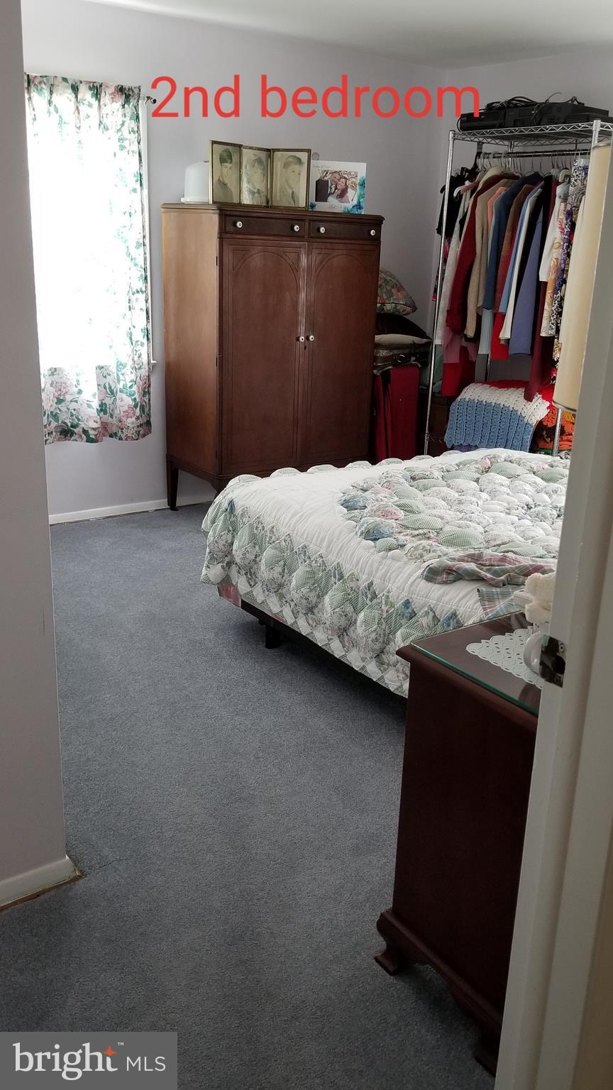 9017 Tammy Road Baltimore, MD 21236 - Photo 19 of 23 a bedroom with a bed and dresser