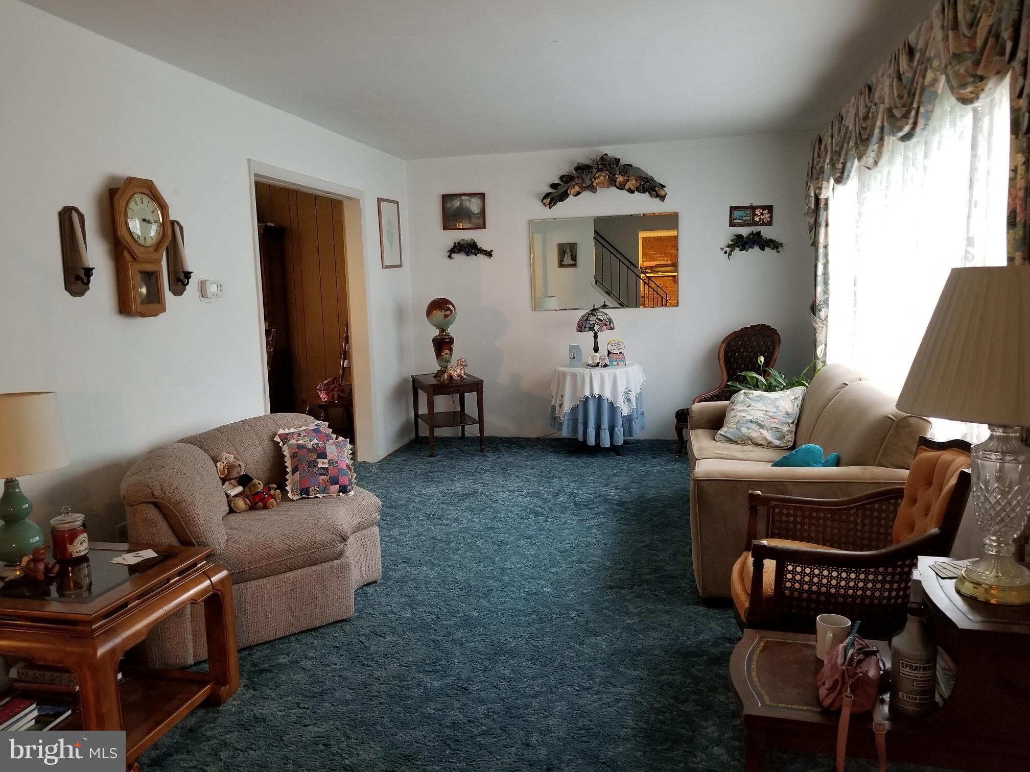 9017 Tammy Road Baltimore, MD 21236 - Photo 5 of 23 a living room with furniture and a window