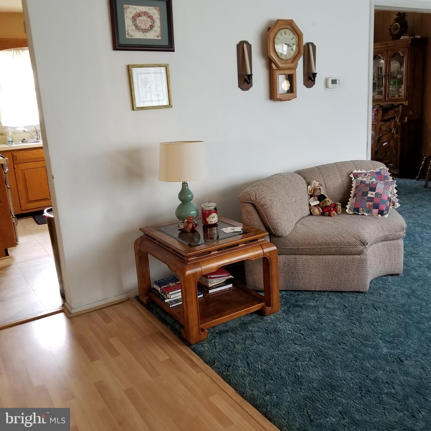 9017 Tammy Road Baltimore, MD 21236 - Photo 6 of 23 a living room with furniture and painting on the wall
