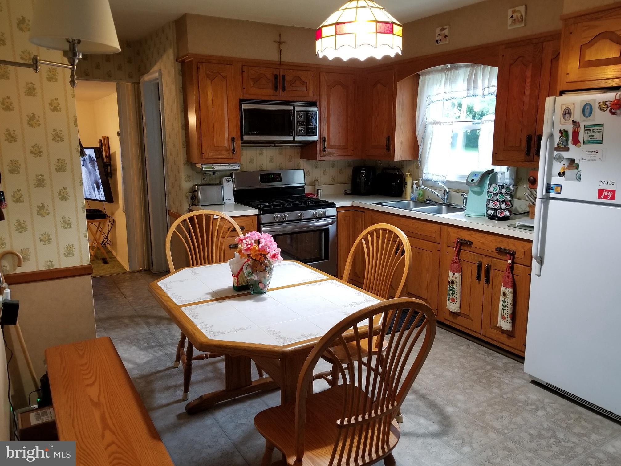 9017 Tammy Road Baltimore, MD 21236 - Photo 9 of 23 a view of a dining room with furniture