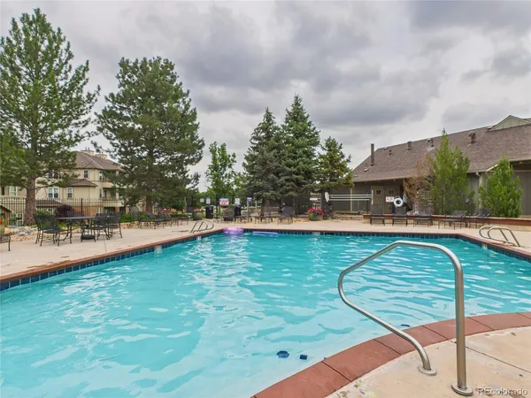 a view of a swimming pool with a patio
