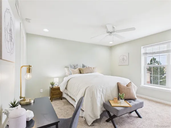 a living room with a bed furniture and a window