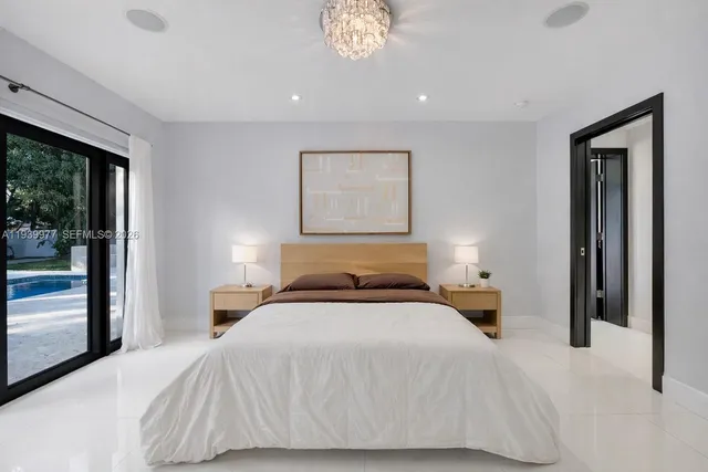 a bathroom with a double vanity sink mirror and toilet