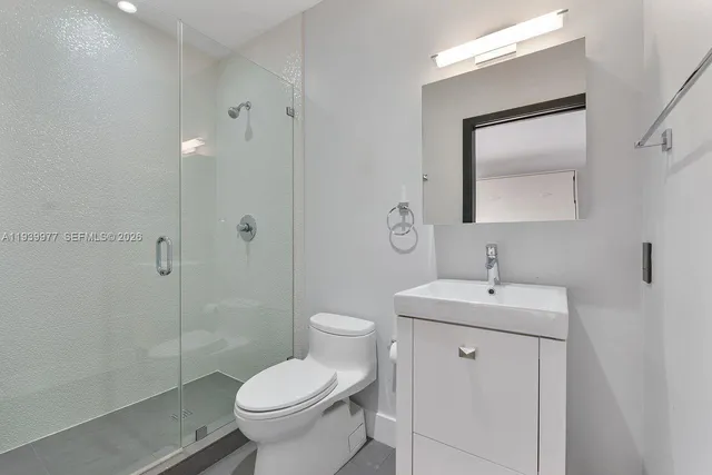 a bedroom with a bed and lamp