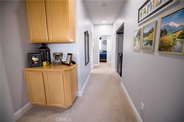 a bathroom with a double vanity sink mirror and shower