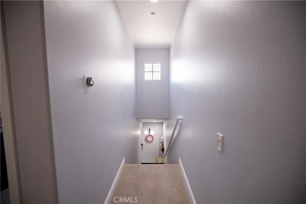 a white toilet sitting next to a bath tub