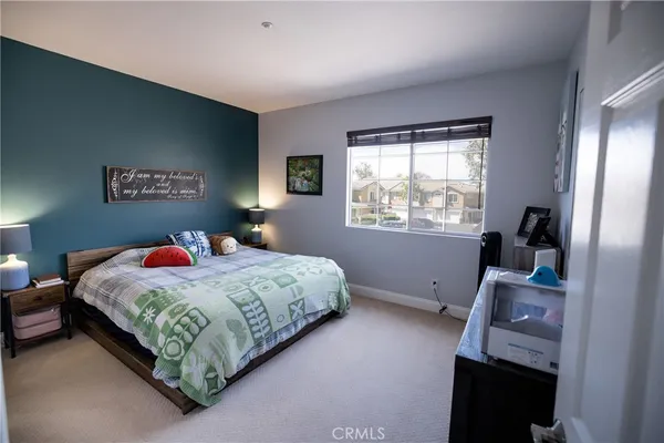 a bed room with a bed and a window