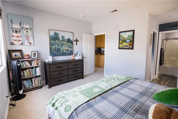 a bed room with a bed and a window
