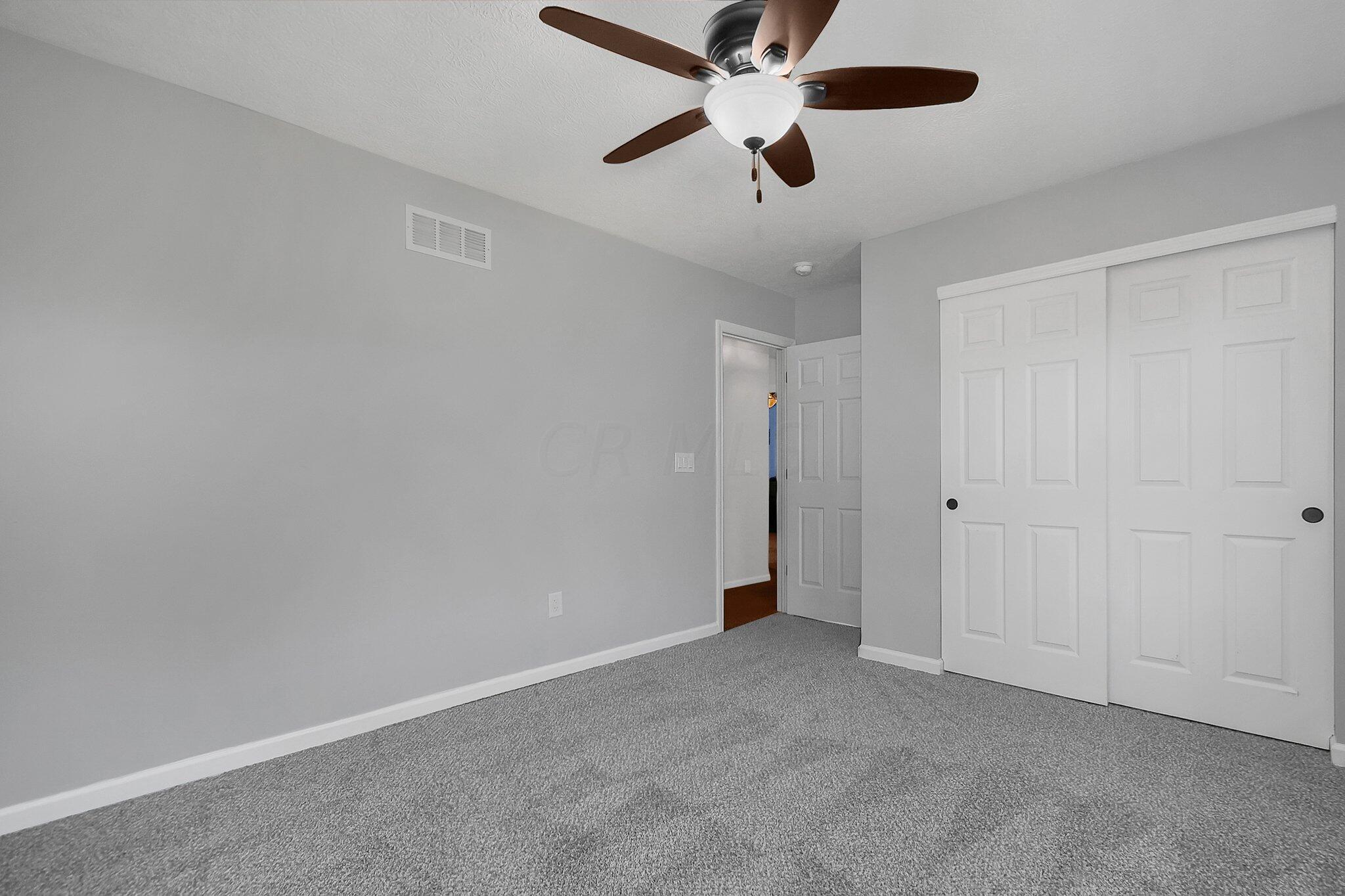 3620 Hyatts Road Powell, OH 43065 - Photo 26 of 54 2nd floor bedroom with light grey walls and grey carpet.