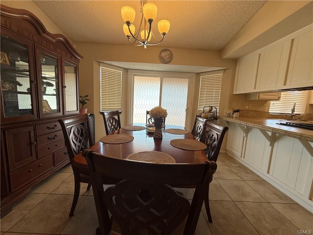 21275 Pocomoke Road Apple Valley, CA 92308 - Photo 13 of 40 a dining room with furniture and window