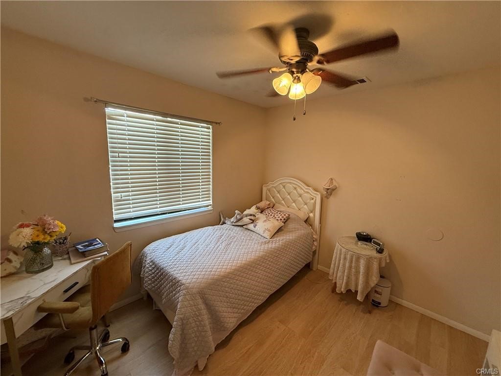 21275 Pocomoke Road Apple Valley, CA 92308 - Photo 25 of 40 a bedroom with a bed and a window
