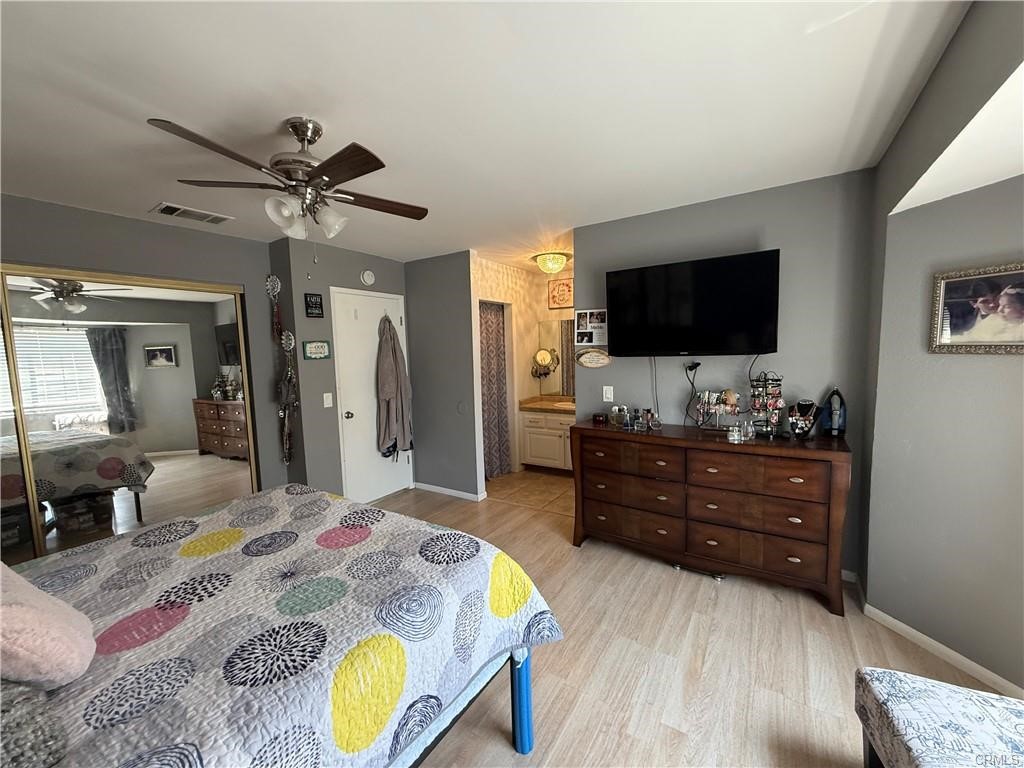 21275 Pocomoke Road Apple Valley, CA 92308 - Photo 27 of 40 a living room with furniture and a flat screen tv