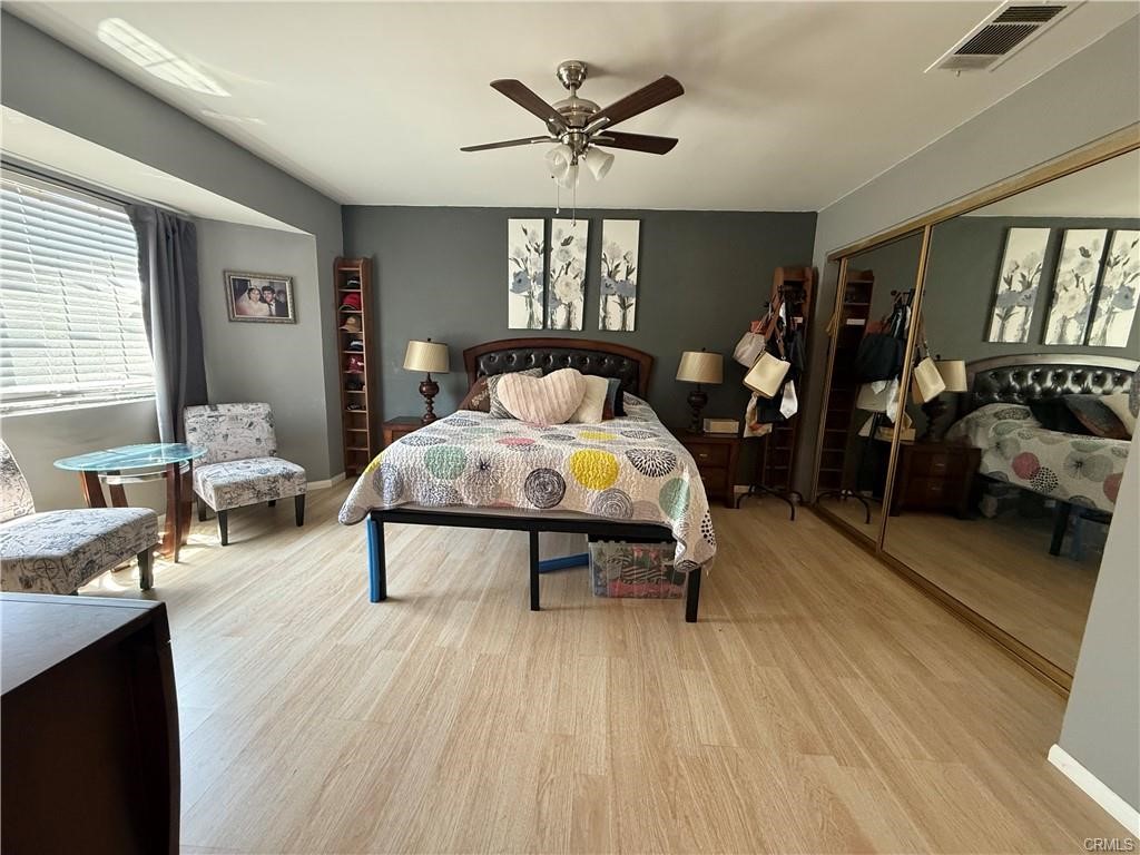 21275 Pocomoke Road Apple Valley, CA 92308 - Photo 28 of 40 a bed room with a bed and a chair