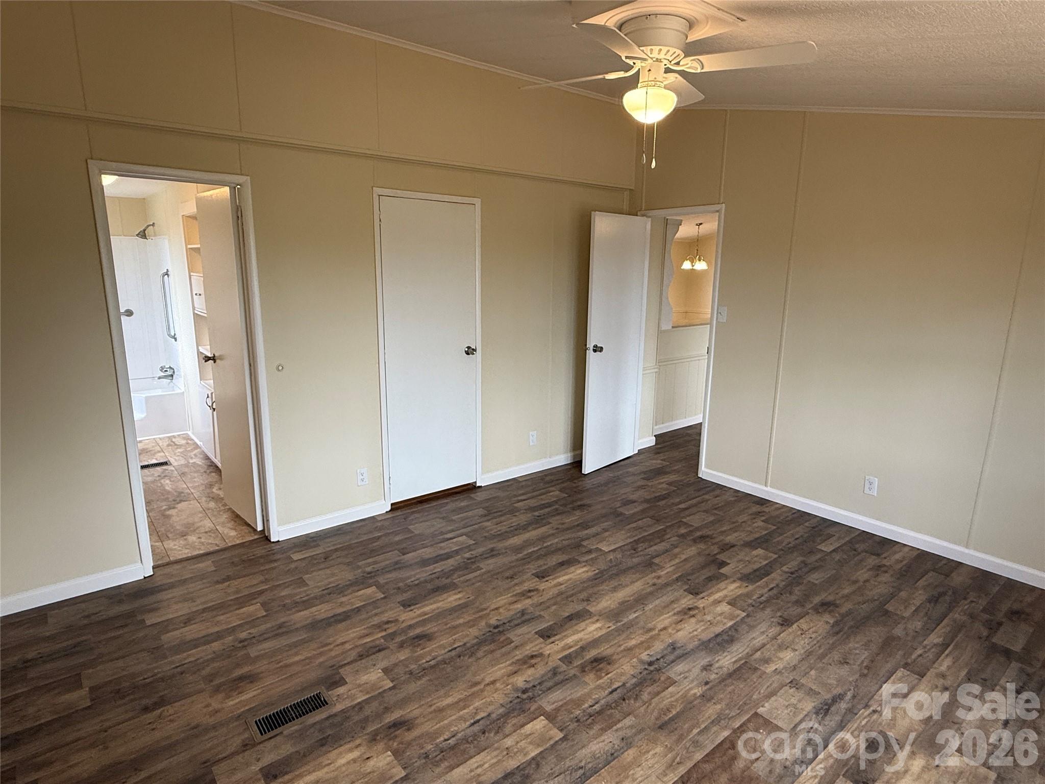 7686 Shoupes Grove Church Road Hickory, NC 28602 - Photo 13 of 36 a view of a livingroom with a ceiling fan and wooden floor