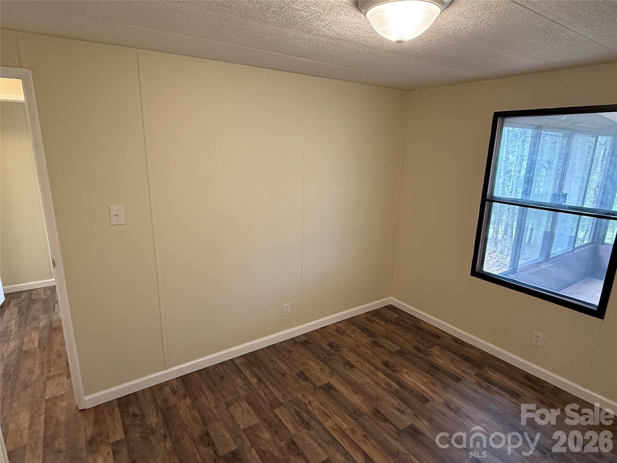 7686 Shoupes Grove Church Road Hickory, NC 28602 - Photo 17 of 36 a view of small space with wooden floor and fan