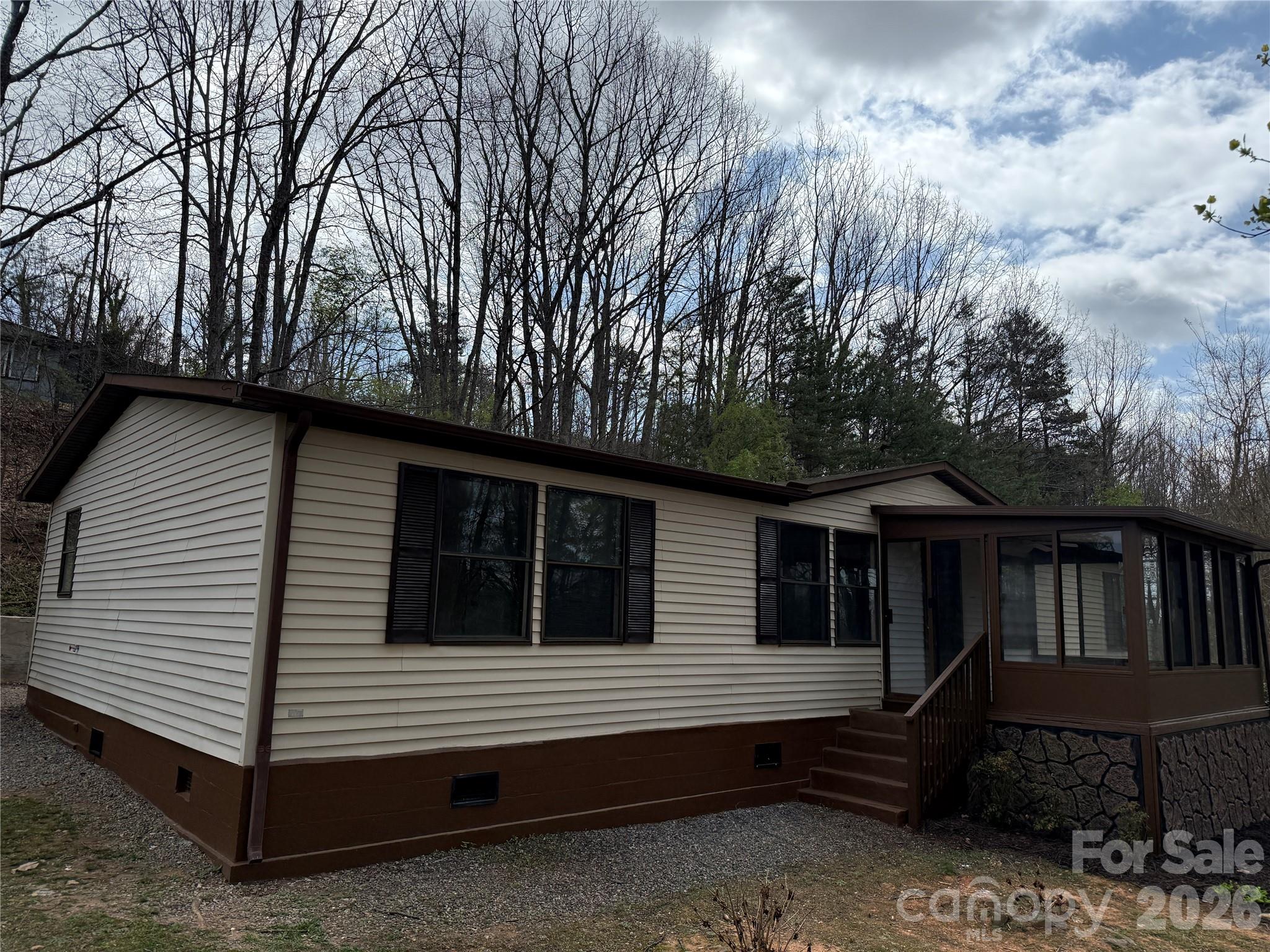 7686 Shoupes Grove Church Road Hickory, NC 28602 - Photo 2 of 36 a view of house with a large window and wooden fence