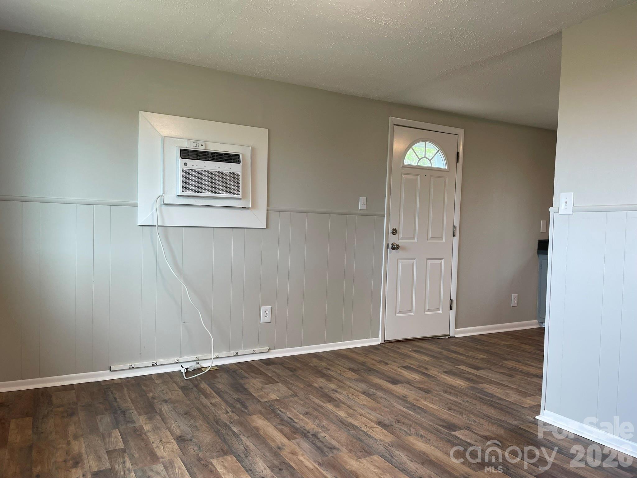 7686 Shoupes Grove Church Road Hickory, NC 28602 - Photo 25 of 36 an empty room with wooden floor and windows