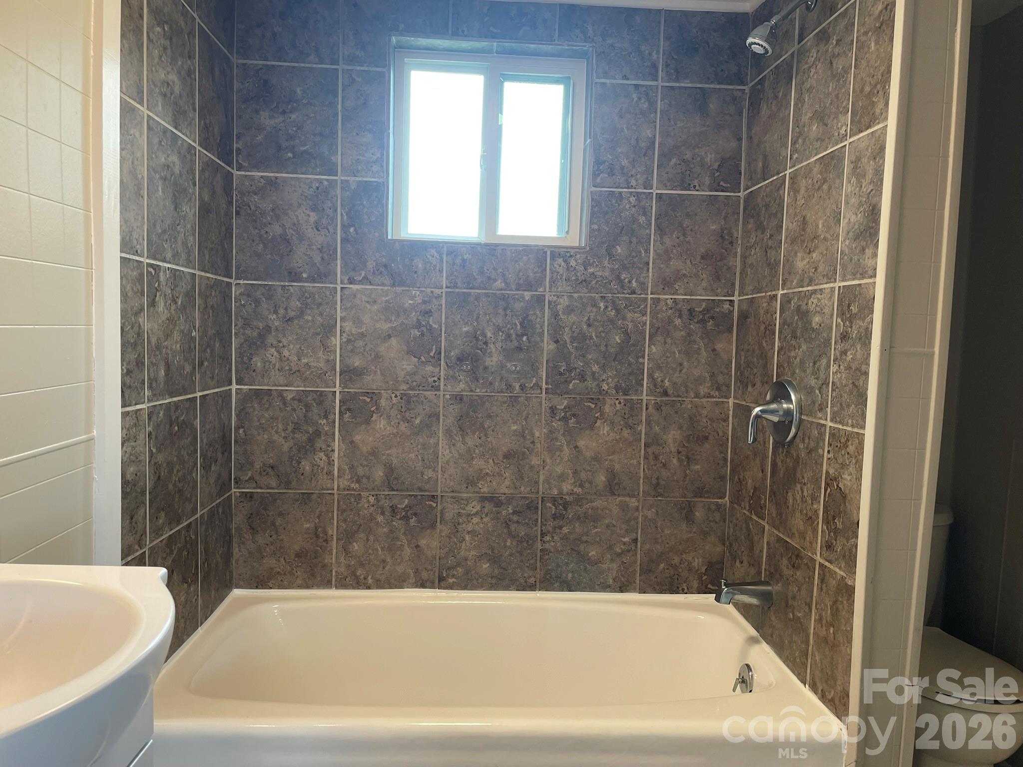 7686 Shoupes Grove Church Road Hickory, NC 28602 - Photo 28 of 36 a bathroom with a bathtub