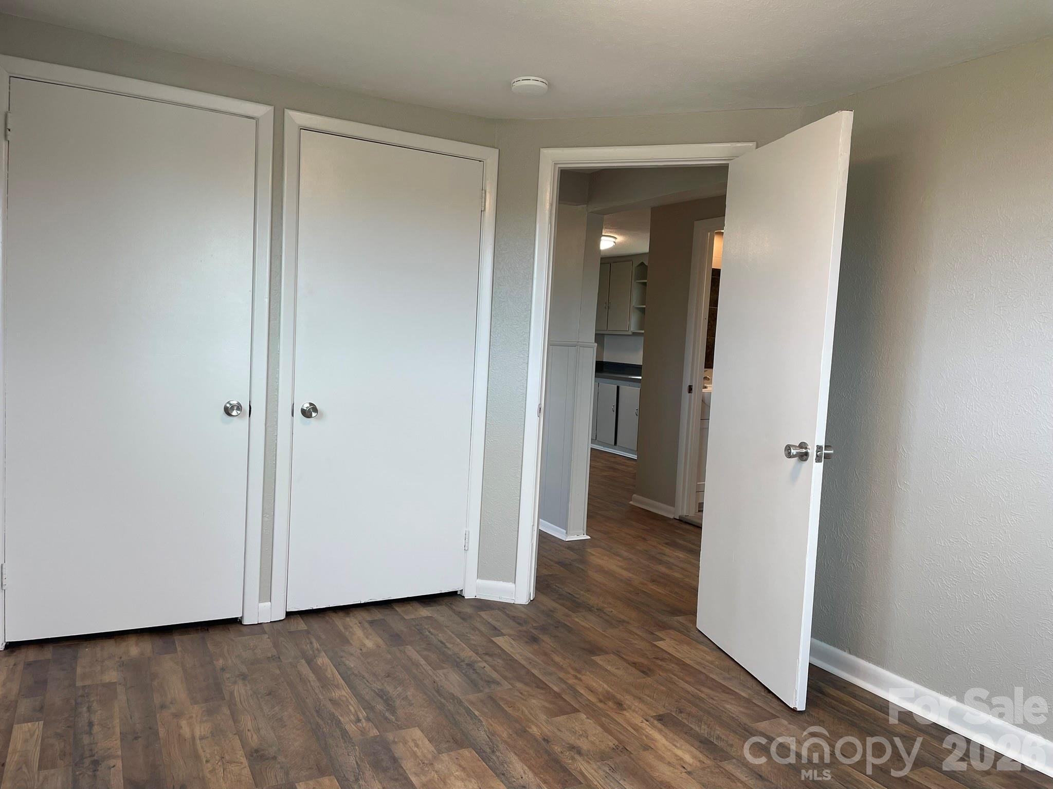 7686 Shoupes Grove Church Road Hickory, NC 28602 - Photo 30 of 36 a view of a hallway with wooden floor