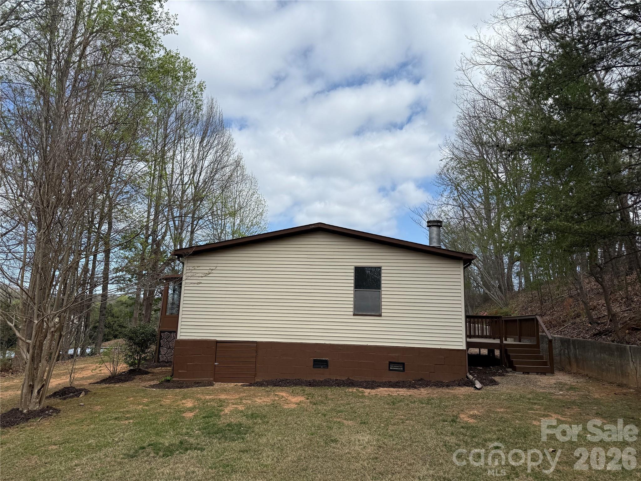 7686 Shoupes Grove Church Road Hickory, NC 28602 - Photo 3 of 36 a view of house with yard and sitting area